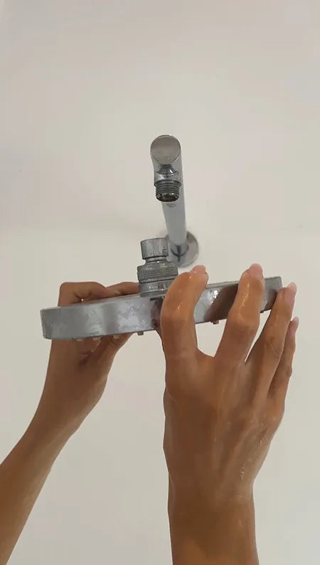 Unscrew old showerhead